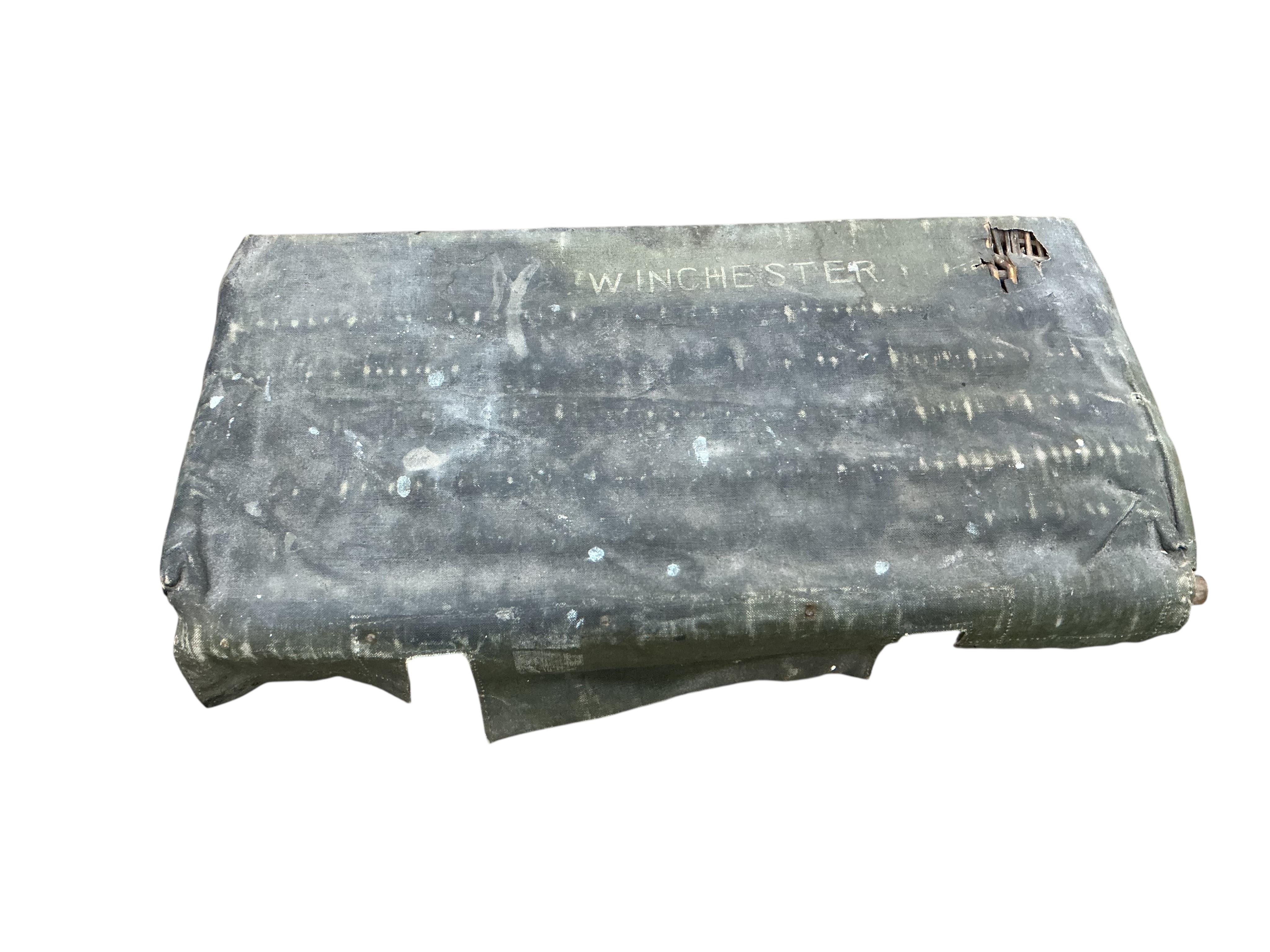An early 20th century military part canvas covered wicker trunk, width 80cm, depth 42cm, height 50cm